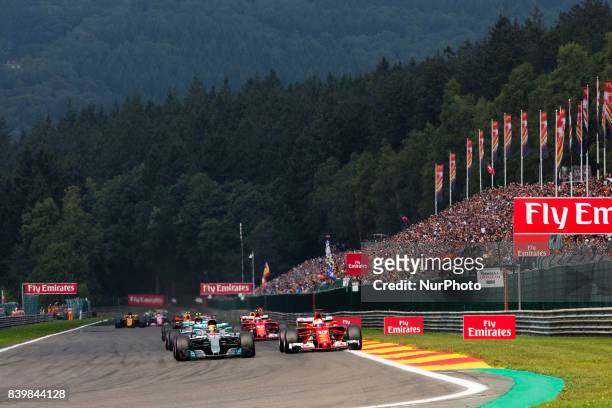 Race start with 44 HAMILTON Lewis from Great Britain of team Mercedes GP and 05 VETTEL Sebastian from Germany of scuderia Ferrari ahead of the group...