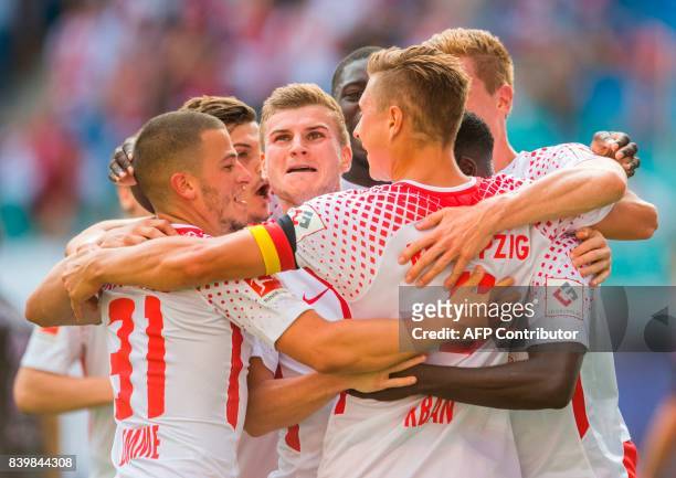 Leipzig´s defender Willi Orban celebrates after scoring the second goal for his team with his teammate striker Timo Werner and midfielder Diego Demme...