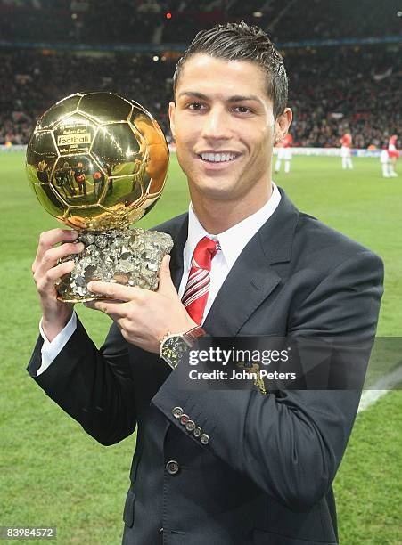 Cristiano Ronaldo of Manchester United poses with the Ballon D'Or ahead of the UEFA Champions League Group E match between Manchester United and...