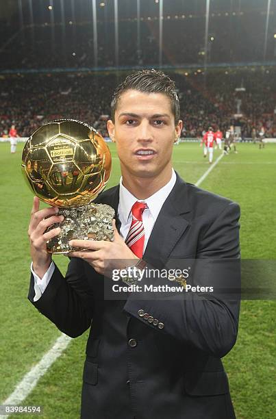 Cristiano Ronaldo of Manchester United poses with the Ballon D'Or ahead of the UEFA Champions League Group E match between Manchester United and...