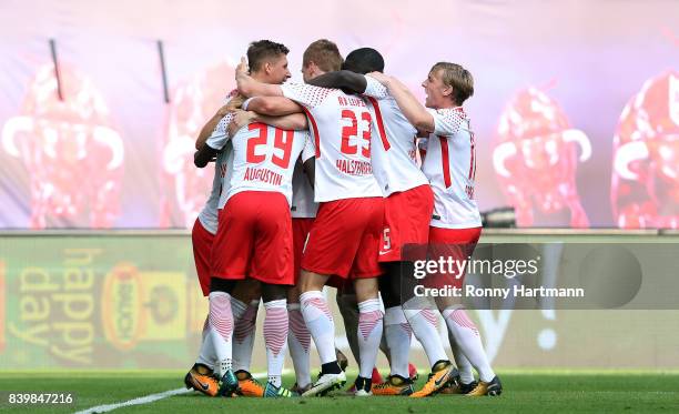 Willi Orban of Leipzig of Leipzig celebrates after scoring his team's second goal with team mates during the Bundesliga match between RB Leipzig and...