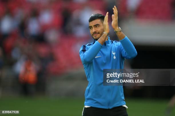 Tottenham's Argentinian goalkeeper Paulo Gazzaniga is introduced to the fans ahead of the English Premier League football match between Tottenham...