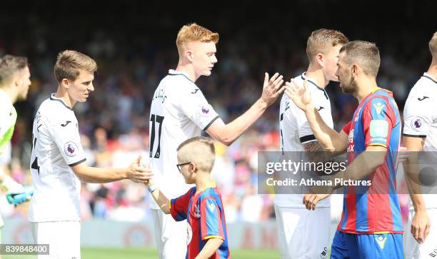 Tom Carroll and Sam Clucas of Swansea City prior to kick off of the Premier League match between Crystal Palace and Swansea City at Selhurst Park on...