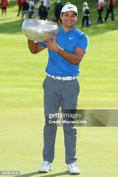 Julian Suri of the United States poses with the trophy following his victory during the final round of Made in Denmark at Himmerland Golf & Spa...