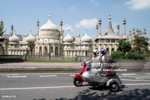 Scooter and side car make their way past The Royal Pavilion during The Mod Weekender, on August 27, 2017 in Brighton, England. Brighton became the...