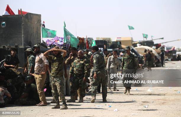 Fighters of Hashed Al-Shaabi gather at the Tal Afar airport, west of Mosul, as Iraqi forces backed by local militia and a US-led coalition advanced...