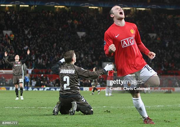 Wayne Rooney of Manchester United celebrates scoring their second goal during the UEFA Champions League Group E match between Manchester United and...