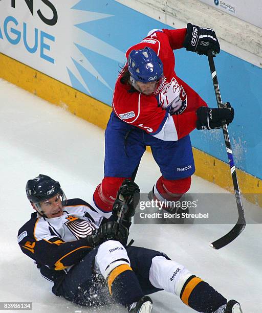 Severin Blindenbacher of ZSC Lions Zurich fights for the puck with Erkki Rajamaki of Espoo Blues during the IIHF Champions Hockey League semi-final...