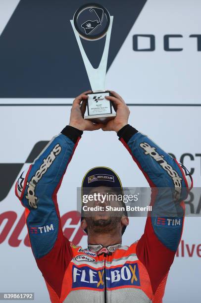 Andrea Dovizioso of Italy and Ducati Team celebates after winning the MotoGP of Great Britain at Silverstone Circuit on August 27, 2017 in...