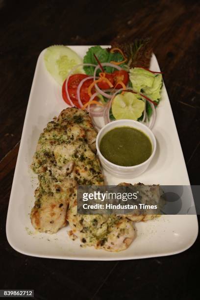 Murgh Mirch Malai Tikka' dish prepared by Chef JP Singh, Executive Chef, Bukhara, ITC Maurya, during the Day 1 of HT City's Culinary Fest, Season...