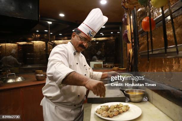 Chef JP Singh, Executive Chef, Bukhara, ITC Maurya, prepares 'Murgh Mirch Malai Tikka' during the Day 1 of HT City's Culinary Fest, Season III, at...