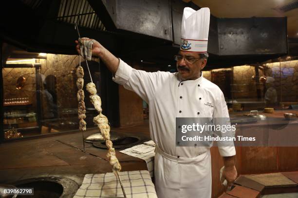 Chef JP Singh, Executive Chef, Bukhara, ITC Maurya, prepares 'Murgh Mirch Malai Tikka' during the Day 1 of HT City's Culinary Fest, Season III, at...