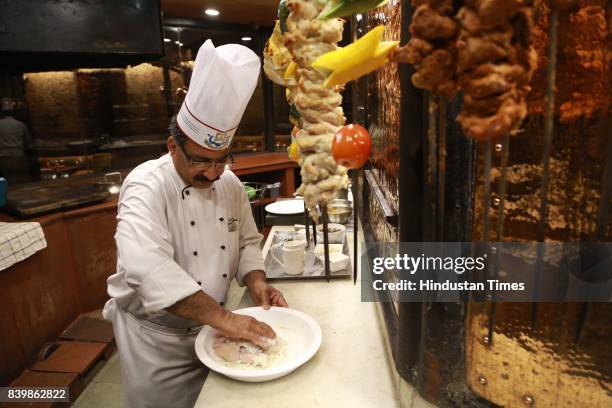 Chef JP Singh, Executive Chef, Bukhara, ITC Maurya, prepares 'Murgh Mirch Malai Tikka' during the Day 1 of HT City's Culinary Fest, Season III, at...