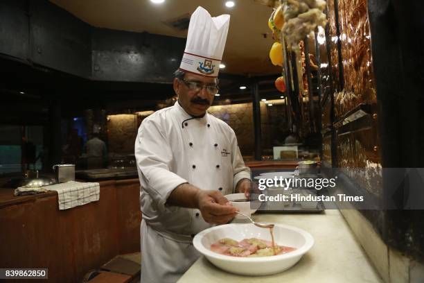 Chef JP Singh, Executive Chef, Bukhara, ITC Maurya, prepares 'Murgh Mirch Malai Tikka' during the Day 1 of HT City's Culinary Fest, Season III, at...