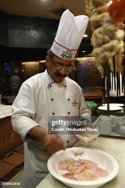 Chef JP Singh, Executive Chef, Bukhara, ITC Maurya, prepares 'Murgh Mirch Malai Tikka' during the Day 1 of HT City's Culinary Fest, Season III, at...