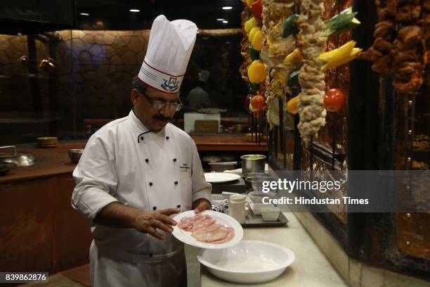 Chef JP Singh, Executive Chef, Bukhara, ITC Maurya, prepares 'Murgh Mirch Malai Tikka' during the Day 1 of HT City's Culinary Fest, Season III, at...