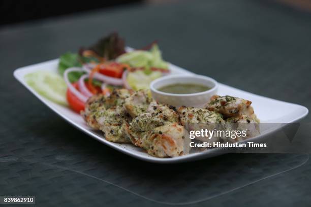 Murgh Mirch Malai Tikka' dish prepared by Chef JP Singh, Executive Chef, Bukhara, ITC Maurya, during the Day 1 of HT City's Culinary Fest, Season...