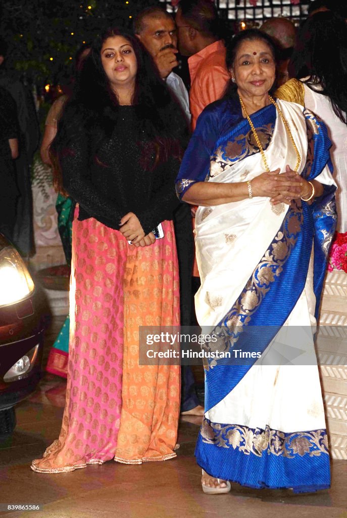 Azaha Genish Bollywood singer Asha Bhosle during the Ganesh Puja hosted by Mukesh ...