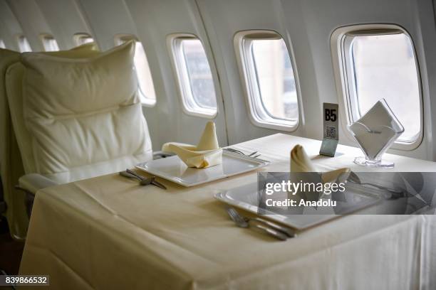 Dining table is seen inside of a Boeing 737, which is used for a restaurant, at Guanggu Walking Street in Wuhan of Hubei Province, China on August...