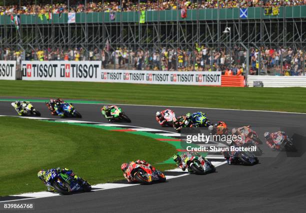 Valentino Rossi of Italy and Movistar Yamaha MotoGP leads on the first lap during the MotoGP of Great Britain at Silverstone Circuit on August 27,...