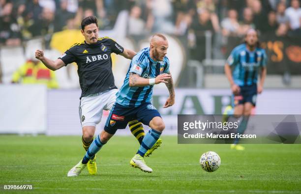 Stefan Ishizaki of AIK and Magnus Eriksson of Djurgardens IF during the Allsvenskan match between AIK and Djurgardens IF at Friends arena on August...