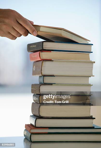 Book Stack Getty 59 Book Stack Hand Stock Photos, High-Res Pictures, and Images - Getty ...