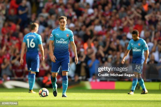 Mesut Ozil of Arsenal reacts during the Premier League match between Liverpool and Arsenal at Anfield on August 27, 2017 in Liverpool, England.