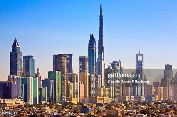 skyline of skyscrapers including the burj dubai - dubai skyline daytime stock pictures, royalty-free photos & images