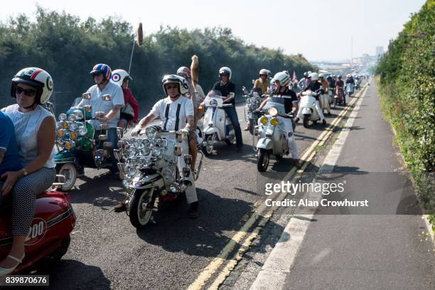 Scooter leave the seafront and make their run out to Peacehaven during The Mod Weekender, on August 27, 2017 in Brighton, England. Brighton became...