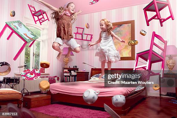 two girls in the middle of a floating tea party - childrens bedroom stock pictures, royalty-free photos & images