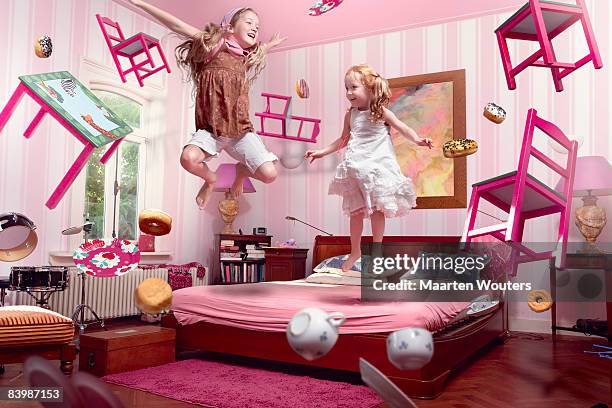 two girls in the middle of a floating tea party - childs bedroom stock pictures, royalty-free photos & images