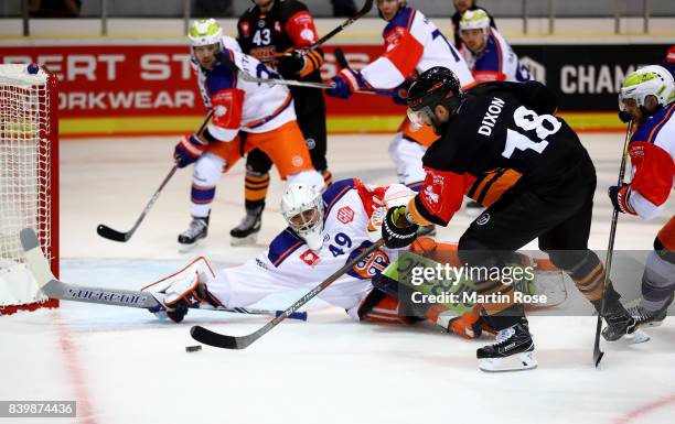 Stephen Dixon of Wolfsburg fails to socre over Dominik Hrachovina, goaltender of Tampere during the Champions Hockey League match between Grizzlys...