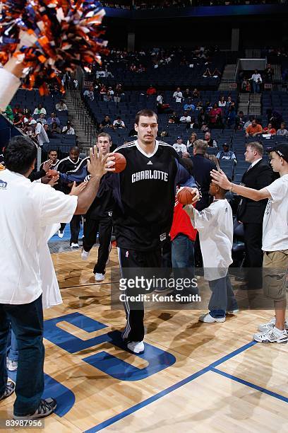 Adam Morrison of the Charlotte Bobcats runs onto the court during introductions prior to the game against the Miami Heat on November 1, 2008 at...