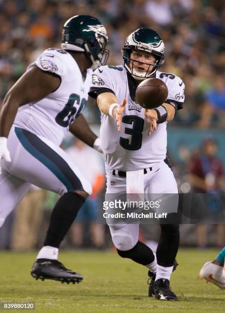 Matt McGloin of the Philadelphia Eagles tosses the ball against the Miami Dolphins in the preseason game at Lincoln Financial Field on August 24,...