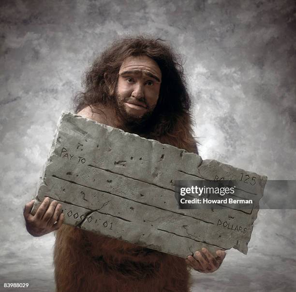 caveman with check - neanderthal fotografías e imágenes de stock