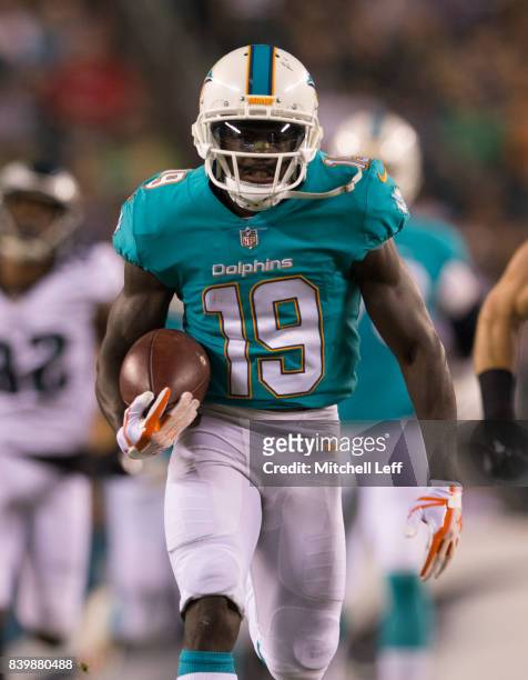 Jakeem Grant of the Miami Dolphins runs for a touchdown in the third quarter in the preseason game against the Philadelphia Eagles at Lincoln...