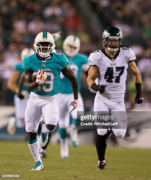Jakeem Grant of the Miami Dolphins runs past Nathan Gerry of the Philadelphia Eagles to score a touchdown in the third quarter in the preseason game...