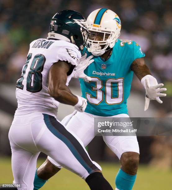 Cordrea Tankersley of the Miami Dolphins covers Shelton Gibson of the Philadelphia Eagles in the preseason game at Lincoln Financial Field on August...