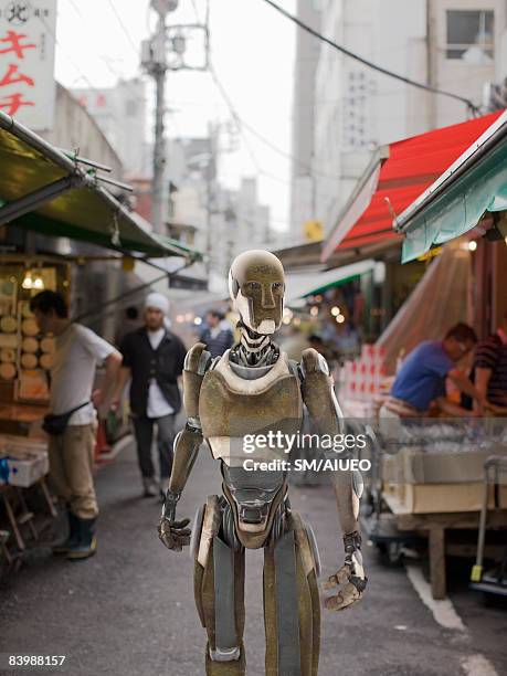 robot walking the market - anthropomorphic stock pictures, royalty-free photos & images