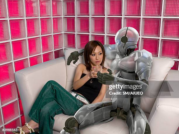 woman and robot sitting together - nur erwachsene stock-fotos und bilder