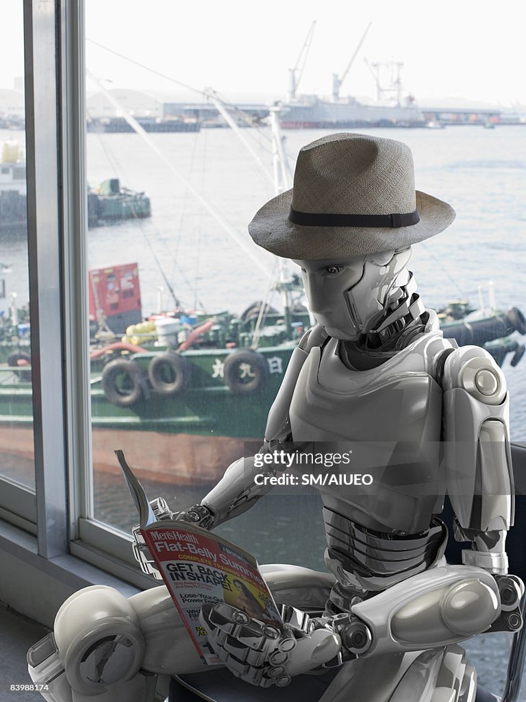 Robot reading a magazine