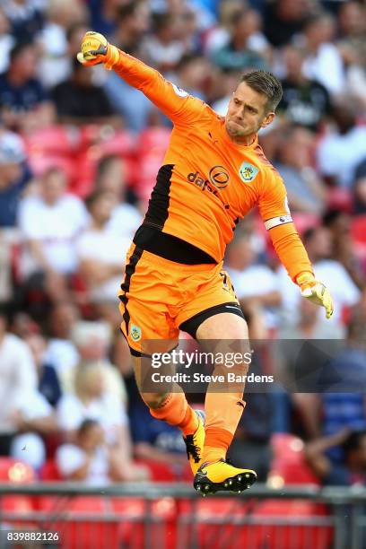 Thomas Heaton of Burnley celebrates his sides first goal during the Premier League match between Tottenham Hotspur and Burnley at Wembley Stadium on...