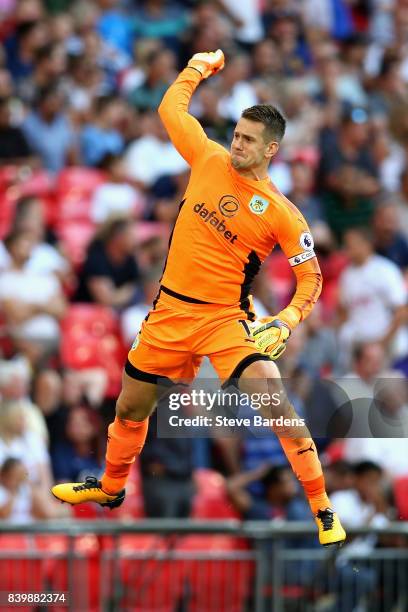 Thomas Heaton of Burnley celebrates his sides first goal during the Premier League match between Tottenham Hotspur and Burnley at Wembley Stadium on...