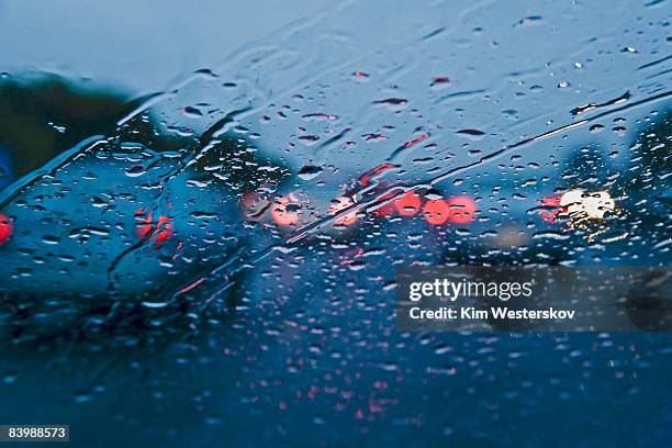 red tail lights through windscreen, motorway      - westerskov stock pictures, royalty-free photos & images