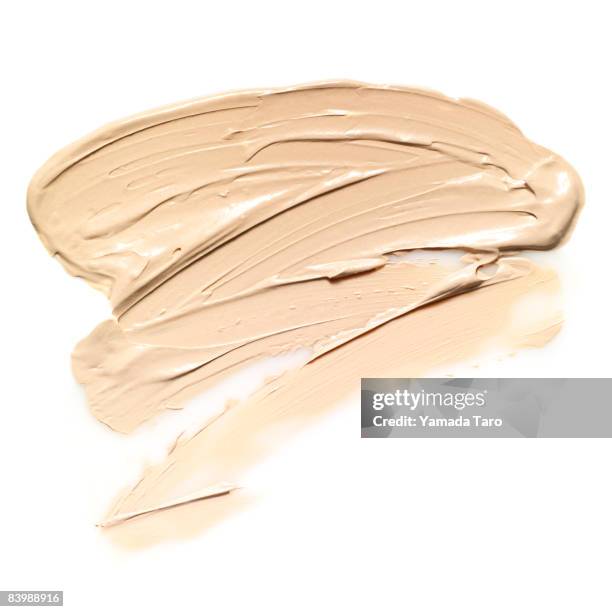 slapped cream foundation on white back - cream coloured stock pictures, royalty-free photos & images