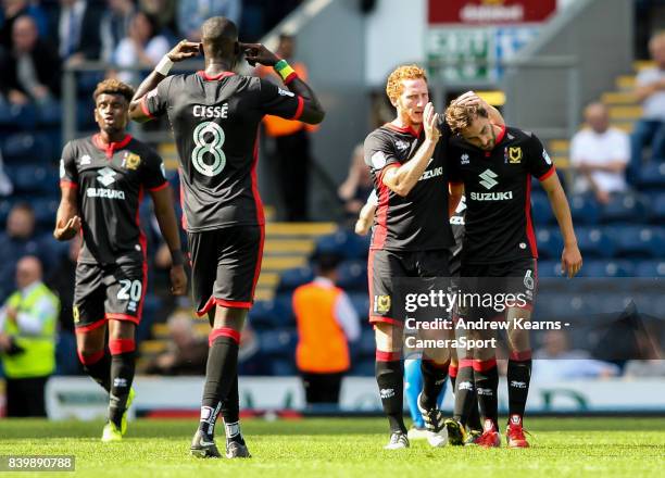 Milton Keynes Dons' Edward Upson celebrates scoring his side's first goal with his team matesduring the Sky Bet League One match between Blackburn...