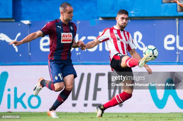 Kike Garcia of SD Eibar duels for the ball with Unai Nunez of Athletic Club during the La Liga match between Eibar and Athletic Club at Estadio...