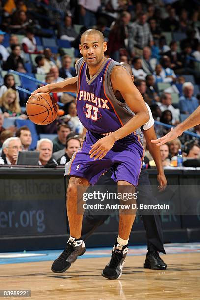 Grant Hill of the Phoenix Suns handles the ball during the game against the New Orleans Hornets at New Orleans Arena on December 3, 2008 in New...