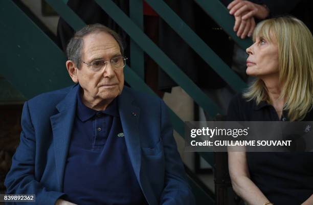 French film and stage director Robert Hossein and his wife French actress Candice Patou attend the 22th La Foret Des Livres book fair on August 27,...