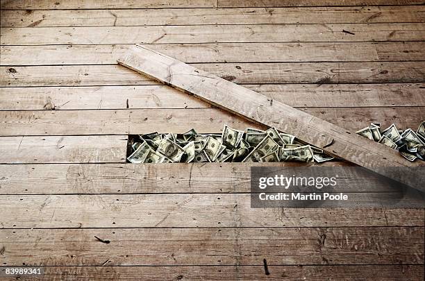 100 dollar bills stashed under a floorboards - gömma bildbanksfoton och bilder